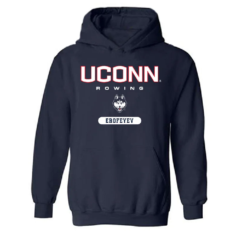 UConn - NCAA Women's Rowing : Evelyn Erofeyev - Classic Shersey Hooded Sweatshirt Hoodie with Hem Raw Edge Edgy Unfinished UConn - NCAA Women's Rowing : Evelyn Erofeyev - Classic Shersey Hooded Sweatshirt Hoodie with Hem Raw Edge Edgy Unfinished